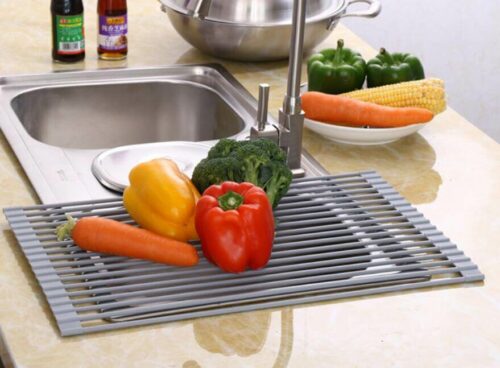 Over the Sink Silicone Roll Up Dish Drying Rack with vegetables on the rack