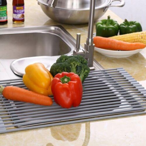 Over the Sink Silicone Roll Up Dish Drying Rack with vegetables on the rack