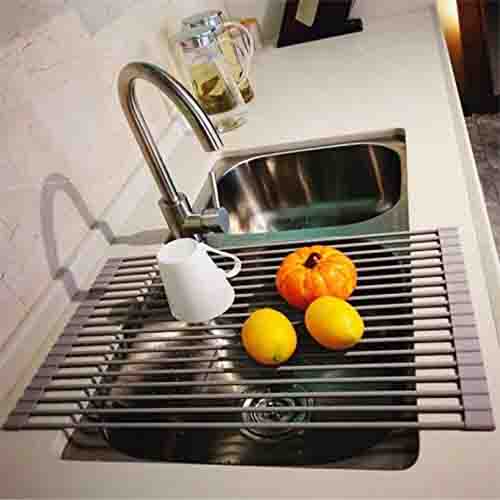 Grey Silicone Roll Up Dish Drying Rack Over the Sink with Fruit and Cup on