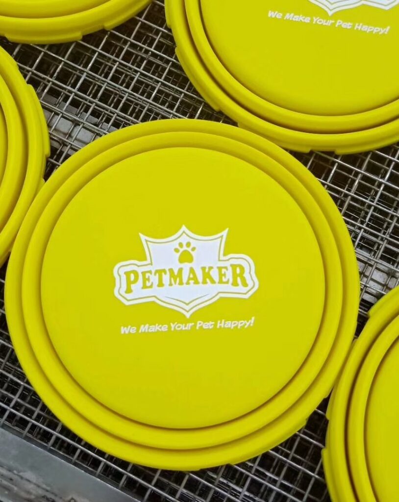 silk screen printing on silicone dog bowl, white logo on yellow bowl
