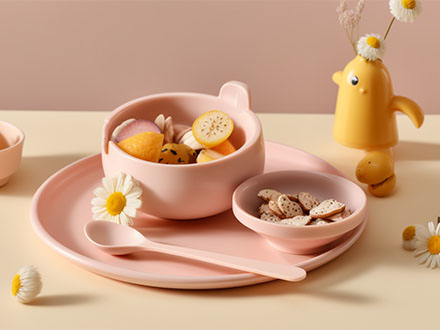 baby eating set with bowl spoon on the table